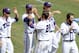 TCU infielder Keaton Jones (26) is congratulated by teammates after scoring a run in the fourth inning of an NCAA college baseball tournament super regional game against Pepperdine in Fort Worth, Saturday, June 7, 2014. (AP Photo/Matt Strasen)