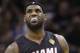 Miami Heat forward LeBron James pauses between plays against the San Antonio Spurs during the first half in Game 2 of the NBA basketball finals on Sunday, June 8, 2014, in San Antonio. (AP Photo/Eric Gay)