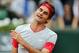 Switzerland's Roger Federer reacts as he plays Latvia's Ernests Gulbis during their fourth round match of the French Open tennis tournament at the Roland Garros stadium, in Paris, France, Sunday, June 1, 2014. (AP Photo/David Vincent)