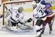 Los Angeles Kings goalie Jonathan Quick (32) blocks a shot by New York Rangers right wing Mats Zuccarello (36) as Kings defenseman Willie Mitchell (33) helps defend in the second period during Game 3 of the NHL hockey Stanley Cup Final, Monday, June 9, 2014, in New York. (AP Photo/Frank Franklin II)