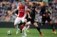 AMSTERDAM, NETHERLANDS - MAY 03: Kolbeinn Sigthorsson of Ajax and Rens Van Eijden of NEC battle for the ball during the Eredivisie match between Ajax Amsterdam and NEC Nijmegen at Amsterdam Arena on May 3, 2014 in Amsterdam, Netherlands. (Photo by Dean Mouhtaropoulos/Getty Images)