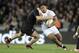 England’s Manu Tuilagi is tackled by New Zealand’s Dane Coles during the International Rugby Test at Eden Park in Auckland, New Zealand, Saturday, June 7, 2014. (AP Photo/SNPA, Ross Setford) NEW ZEALAND OUT