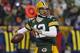 FILE - In this Jan. 5, 2014, file photo, Green Bay Packers quarterback Aaron Rodgers looks to pass against the San Francisco 49ers during an NFL wild-card playoff football game in Green Bay, Wis. Signing with an agent usually is the first career move a college player makes in turning pro. Some agents boast their successful clientele at certain positions, or alumnus from certain schools. “A lot like a restaurant, it’s word of mouth, but frankly (that) isn’t the worst way to build a business,” said David Dunn, who represents Rodgers among the stockpile of players represented by his firm, Athletes First. (AP Photo/Matt Ludtke, File)