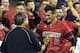 Louisville's Nick Burdi, right, is congratulated by Louisville athletic director Tom Jurich following the team's 7-4 victory over Kennesaw State in an NCAA college baseball tournament super regional game in Louisville, Ky., Saturday, June 7, 2014. (AP Photo/Timothy D. Easley)