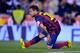 Barcelona's Jordi Alba grimaces while holding his leg during the final of the Copa del Rey between FC Barcelona and Real Madrid at the Mestalla stadium in Valencia, Spain, Wednesday, April 16, 2014. (AP Photo/Manu Fernandez)