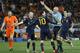 Spain's Cesc Fabregas, center with back to camera, and Spain's Andres Iniesta, second from left, contest a decision by referee Howard Webb, of England, second from right, during the World Cup final soccer match between the Netherlands and Spain at Soccer City in Johannesburg, South Africa, Sunday, July 11, 2010. (AP Photo/Bernat Armangue)