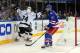 Jun 9, 2014; New York, NY, USA; Los Angeles Kings center Jeff Carter (rear) celebrates with left wing Dwight King (74) after scoring a goal as New York Rangers defenseman John Moore (17) skates away during the first period in game three of the 2014 Stanley Cup Final at Madison Square Garden. Mandatory Credit: Brad Penner-USA TODAY Sports