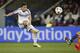 Chelsea's Eden Hazard takes a shot during the Champions League quarterfinal first leg soccer match between PSG and Chelsea, at the Parc des Princes stadium, in Paris, Wednesday, April 2, 2014. (AP Photo/Christophe Ena)