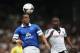 LONDON, ENGLAND - MARCH 30: Sylvain Distin of Everton runs for the ball with Moussa Dembele of Fulham during the Barclays Premier League match between Fulham and Everton at Craven Cottage on March 30, 2014 in London, England. (Photo by Scott Heavey/Getty Images)