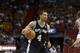 San Antonio Spurs' Danny Green (4) looks to pass as Miami Heat's James Jones (22) defends during the first half of an NBA preseason basketball game, Saturday, Oct. 19, 2013, in Miami. (AP Photo/Lynne Sladky)