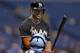 Miami Marlins' Giancarlo Stanton smiles as he talk to Tampa Bay Rays catcher Jose Molina prior to batting during the first inning of an interleague baseball game Wednesday, June 4, 2014, in St. Petersburg, Fla. (AP Photo/Chris O'Meara)