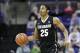 Spencer Dinwiddie dribbles up court against Washington in the first half of an NCAA men's basketball game Sunday, Jan. 12, 2014, in Seattle. (AP Photo/Elaine Thompson)
