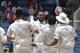 New Zealand's bowler Mark Craig, center facing camera, celebrates with teammates after taking the wicket of West Indies Kirk Edwards who was caught by New Zealand's Ross Taylor for a duck during the third day of their first cricket Test match in Kingston, Jamaica, Tuesday, June 10, 2014. (AP Photo/Arnulfo Franco)