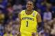 Michigan's Glenn Robinson III reacts after making a shot during the first half of an NCAA Midwest Regional final college basketball tournament game against Kentucky Sunday, March 30, 2014, in Indianapolis. (AP Photo/Michael Conroy)