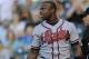 Atlanta Braves Justin Upton reacts to striking out in the first inning of a baseball game against the Colorado Rockies on Monday, June 9, 2014, in Denver. (AP Photo/Chris Schneider)