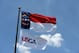 PINEHURST, NC - JUNE 10: A USGA and North Carolina state flag blow in the breeze during a practice round prior to the start of the 114th U.S. Open at Pinehurst Resort & Country Club, Course No. 2 on June 10, 2014 in Pinehurst, North Carolina. (Photo by Ross Kinnaird/Getty Images)