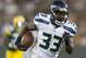Aug 23, 2013; Green Bay, WI, USA; Seattle Seahawks running back Christine Michael (33) rushes for a touchdown during the third quarter against the Green Bay Packers at Lambeau Field. Seattle won 17-10. Mandatory Credit: Jeff Hanisch-USA TODAY Sports