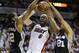 San Antonio Spurs forward Tim Duncan (21) and forward Kawhi Leonard (2) defend Miami Heat forward LeBron James (6), during the first half in Game 3 of the NBA basketball finals, Tuesday, June 10, 2014, in Miami. (AP Photo/Wilfredo Lee)