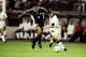 30 Jun 1998: Michael Owen of England shrugs off Jose Chamot of Argentina on his way to goal during the World Cup second round match at the Stade Geoffroy Guichard in St Etienne, France. England lost 4-3 on penalties after a 2-2 draw. \ Mandatory Credit:Ross Kinnaird /Allsport