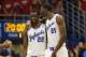 Kansas guard Andrew Wiggins (22) and center Joel Embiid (21) during the first half of an NCAA college basketball game against Oklahoma State at Allen Fieldhouse in Lawrence, Kan., Saturday, Jan. 18, 2014. (AP Photo/Orlin Wagner)