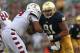 SOUTH BEND, IN - AUGUST 31: Sheldon Day #91 of the Notre Dame Fighting Irish rushes against Zach Hooks #54 of the Temple Owls at Notre Dame Stadium on August 31, 2013 in South Bend, Indiana. Notre Dame defeated Temple 28-6. (Photo by Jonathan Daniel/Getty Images)