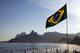 RIO DE JANEIRO, BRAZIL - JUNE 08: A Brazilian flag waves on Ipanema Beach as the 2014 FIFA World Cup nears on June 8, 2014 in Rio de Janeiro, Brazil. (Photo by Jamie Squire/Getty Images)