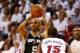MIAMI, FL - JUNE 10: Tony Parker #9 of the San Antonio Spurs looks to pass as Mario Chalmers #15 of the Miami Heat defends during Game Three of the 2014 NBA Finals at American Airlines Arena on June 10, 2014 in Miami, Florida. NOTE TO USER: User expressly acknowledges and agrees that, by downloading and or using this photograph, User is consenting to the terms and conditions of the Getty Images License Agreement. (Photo by Andy Lyons/Getty Images)