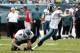 Philadelphia Eagles kicker Alex Henery (6) kicks a point after as Philadelphia Eagles punter Chas Henry (8) holds in the second half of an NFL football game against the Baltimore Ravens Sunday, Sept. 16, 2012, in Philadelphia. (AP Photo/Mel Evans)