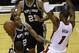San Antonio Spurs forward Kawhi Leonard (2) goes to the basket against Miami Heat center Chris Bosh (1) in the first half in Game 3 of the NBA basketball finals, Tuesday, June 10, 2014, in Miami. (AP Photo/Lynne Sladky)