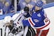 New York Rangers center Dominic Moore (28) crashes the boards against Los Angeles Kings right wing Justin Williams (14) in the third period during Game 4 of the NHL hockey Stanley Cup Final, Wednesday, June 11, 2014, in New York. The Rangers won the game 2-1. (AP Photo/Seth Wenig)