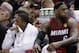 Miami Heat guard Mario Chalmers, left, and forward LeBron James watch action against the San Antonio Spurs from the bench during the second half in Game 1 of the NBA basketball finals on Thursday, June 5, 2014 in San Antonio. (AP Photo/Eric Gay)