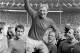England's captain Bobby Moore chaired by hat-trick hero Geoff Hurst (left) and Ray Wilson as he salutes the crowd with the Jules Rimet Trophy after their 4-2 victory against West Germany at Wembley, on July 30, 1966. England beat West Germany 4-2 after extra-time at Wembley. (AP Photo/Bippa)