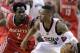 Portland Trail Blazers guard Damian Lillard, right, works against Houston Rockets guard Patrick Beverley during the first half of Game 3 of an NBA basketball first-round playoff series in Portland, Ore., Friday, April 25, 2014. (AP Photo/Don Ryan)