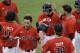 Texas Tech's Devon Conley (28) and Tim Proudfoot, second from right, rear, are congratulated by their teammates after scoring in the ninth inning on a single by Zach Davis against Miami during an NCAA college baseball regional tournament in Coral Gables, Fla., Monday, June 2, 2014. Texas Tech defeated Miami 4-0 to advance to the Super Regionals. (AP Photo/Lynne Sladky)