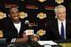 Los Angeles Lakers Kobe Bryant, left, shakes hands with general manger Mitch Kupchak after signing his contract during a news conference Thursday, July 15, 2004, at the team's training facility in El Segundo, Calif. Bryant chose the Lakers over the Clippers, remaining with the team he joined in 1996 at age 18 and later helped win three NBA championships (AP Photo/Kevork Djansezian)