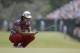 Kevin Na reacts to his putt sixth hole during the first round of the U.S. Open golf tournament in Pinehurst, N.C., Thursday, June 12, 2014. (AP Photo/Eric Gay)