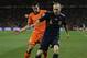 Spain's Andres Iniesta, right, and Netherlands' Robin van Persie, left during the World Cup final soccer match between the Netherlands and Spain at Soccer City in Johannesburg, South Africa, Sunday, July 11, 2010. (AP Photo/Martin Meissner)