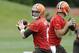 Cleveland Browns quarterback Brian Hoyer looks to pass at a mandatory minicamp practice at the NFL football team's facility in Berea, Ohio Wednesday, June 11, 2014. (AP Photo/Mark Duncan)