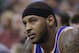 New York Knicks' Carmelo Anthony (7) looks on as he sits on the bench in the second quarter during an NBA basketball game against the Utah Jazz Monday, March 31, 2014, in Salt Lake City. (AP Photo/Rick Bowmer)