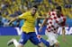 Brazil's Oscar, left, and Croatia's Sime Vrsaljko battle for the ball during the group A World Cup soccer match between Brazil and Croatia, the opening game of the tournament, in the Itaquerao Stadium in Sao Paulo, Brazil, Thursday, June 12, 2014. (AP Photo/Kirsty Wigglesworth)