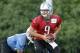 Detroit Lions quarterback Matthew Stafford (9) drops back to hand off the ball during the final day of NFl football minicamp Thursday, June 12, 2014, in Allen Park, Mich. (AP Photo/Duane Burleson)