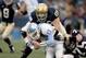 SOUTH BEND, IN - NOVEMBER 4: Quarterback Cam Sexton #11 of the North Carolina Tar Heels is sacked by Ryan Harris #68 of the Notre Dame Fighting Irish on November 4, 2006 at Notre Dame Stadium in South Bend, Indiana. (Photo by Jonathan Daniel/Getty Images)