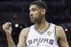San Antonio Spurs forward Tim Duncan gestures between plays against the Miami Heat during the first half in Game 2 of the NBA basketball finals on Sunday, June 8, 2014, in San Antonio. Miami won 98-96. (AP Photo/Eric Gay)