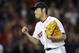 Boston Red Sox relief pitcher Koji Uehara pumps his fist after getting the save in a 5-2 win against the Cleveland Indians during a baseball game at Fenway Park in Boston, Thursday, June 12, 2014. (AP Photo/Charles Krupa)