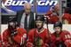 Chicago Blackhawks head coach Joel Quenneville, top, and Brandon Saad (20), Michal Handzus (26) and Marcus Kruger (16) react after Los Angeles Kings' Jeff Carter scored a goal during the third period in Game 2 of the Western Conference finals in the NHL hockey Stanley Cup playoffs in Chicago on Wednesday, May 21, 2014. (AP Photo/Nam Y. Huh)