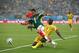 NATAL, BRAZIL - JUNE 13: Marco Fabian of Mexico is tackled by Dany Nounkeu of Cameroon during the 2014 FIFA World Cup Brazil Group A match between Mexico and Cameroon at Estadio das Dunas on June 13, 2014 in Natal, Brazil. (Photo by Julian Finney/Getty Images)