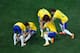 SAO PAULO, BRAZIL - JUNE 12: Oscar of Brazil lies on the ground in celebration with David Luiz, Dani Alves, Fred and Bernard during the 2014 FIFA World Cup Brazil Group A match between Brazil and Croatia at Arena de Sao Paulo on June 12, 2014 in Sao Paulo, Brazil. (Photo by Pool/Getty Images)