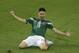 Mexico's Oribe Peralta celebrates after scoring during the group A World Cup soccer match between Mexico and Cameroon in the Arena das Dunas in Natal, Brazil, Friday, June 13, 2014. (AP Photo/Hassan Ammar)