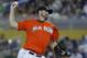 Miami Marlins' Heath Bell delivers a pitch during the eighth inning of a baseball game against the San Diego Padres, Sunday, July 29, 2012 in Miami. The Marlins won 5-4 in 10 innings. (AP Photo/Wilfredo Lee)