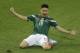 Mexico's Oribe Peralta celebrates after scoring during the group A World Cup soccer match between Mexico and Cameroon in the Arena das Dunas in Natal, Brazil, Friday, June 13, 2014. (AP Photo/Hassan Ammar)